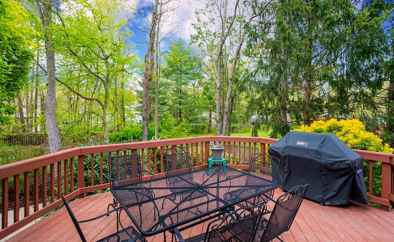 Seating on the deck under the tree line