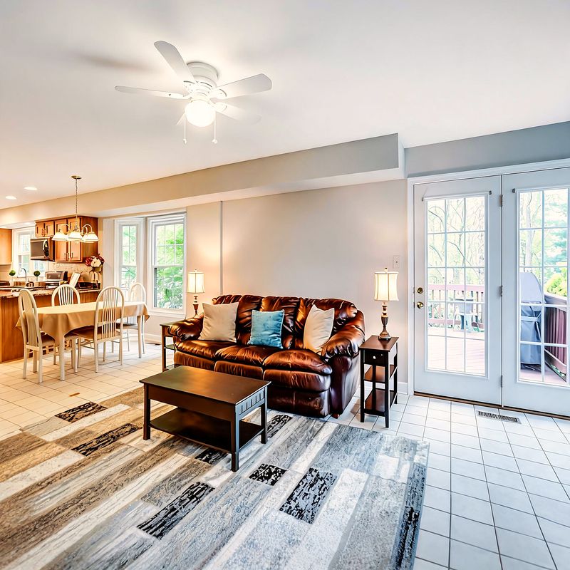 The family room, opening onto the deck through french doors
